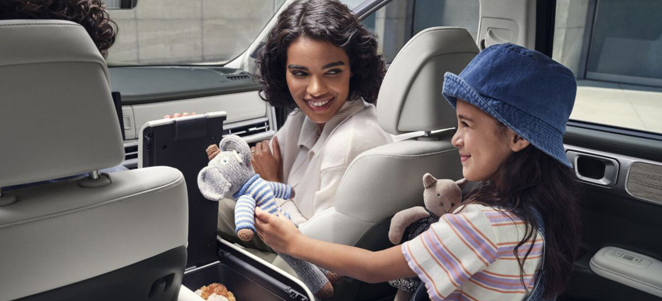 A family riding in a Santa Fe