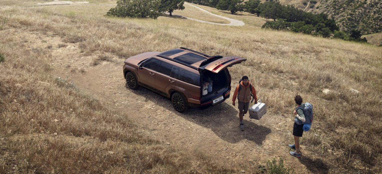 Campers unloading gear through the Santa Fe tailgate